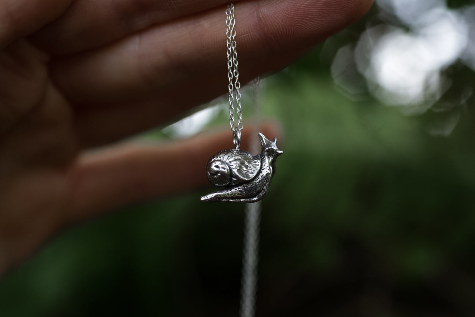 Miniature silver snail necklace